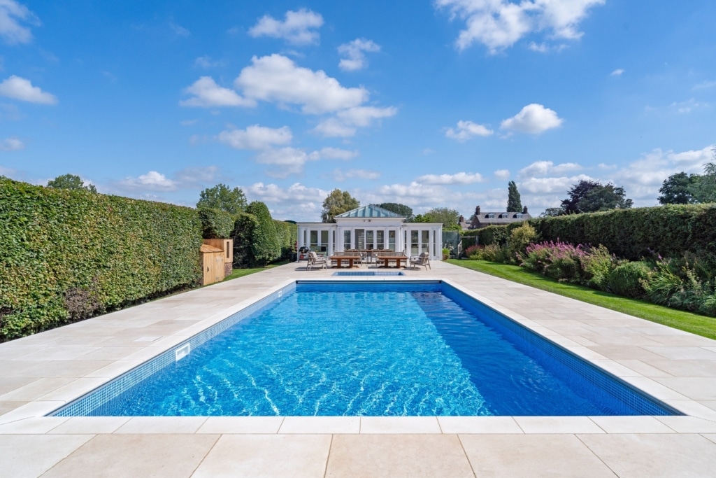 limestone tiles around outdoor swimming pool